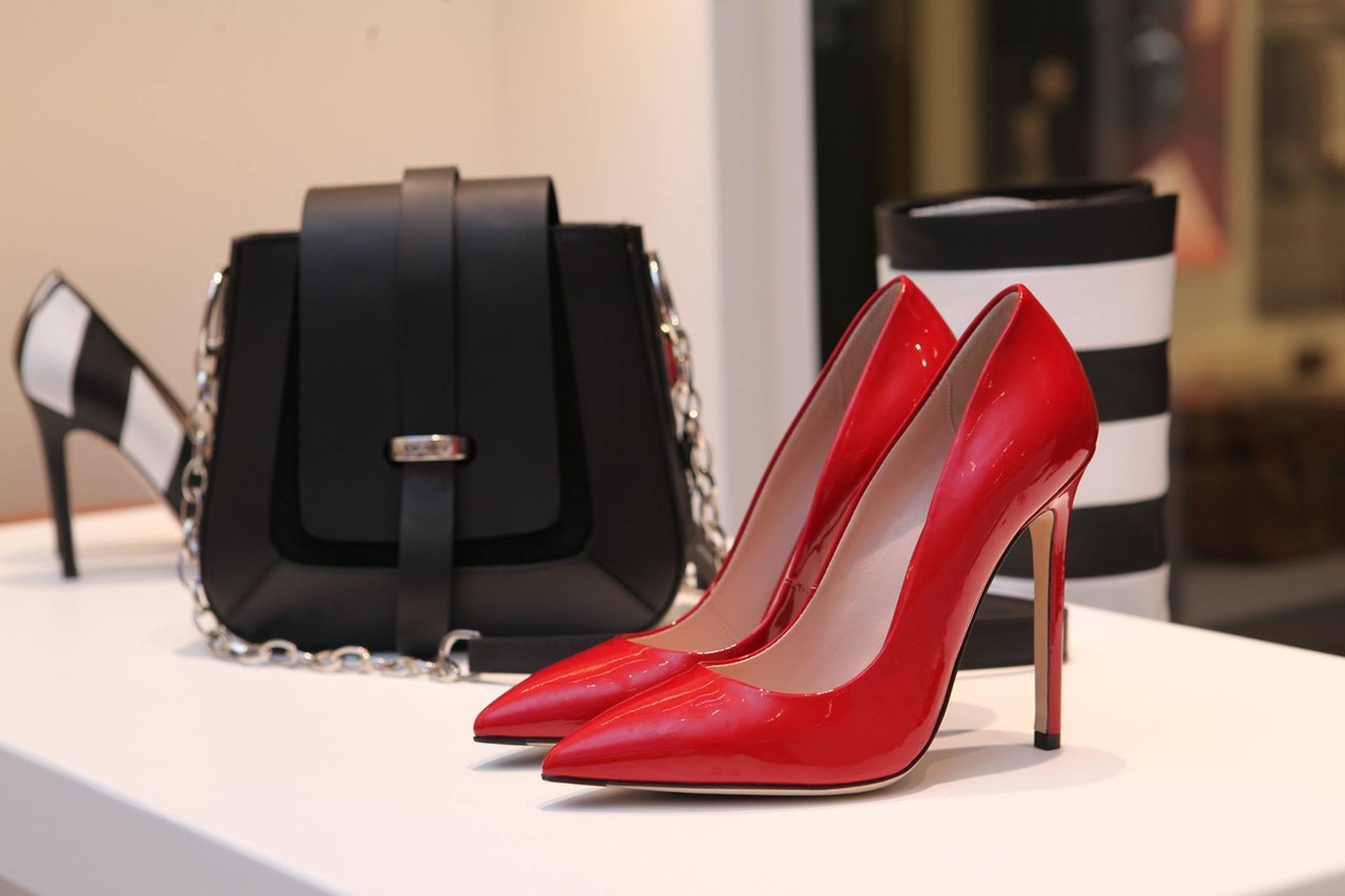 Red heels at store with pure in background