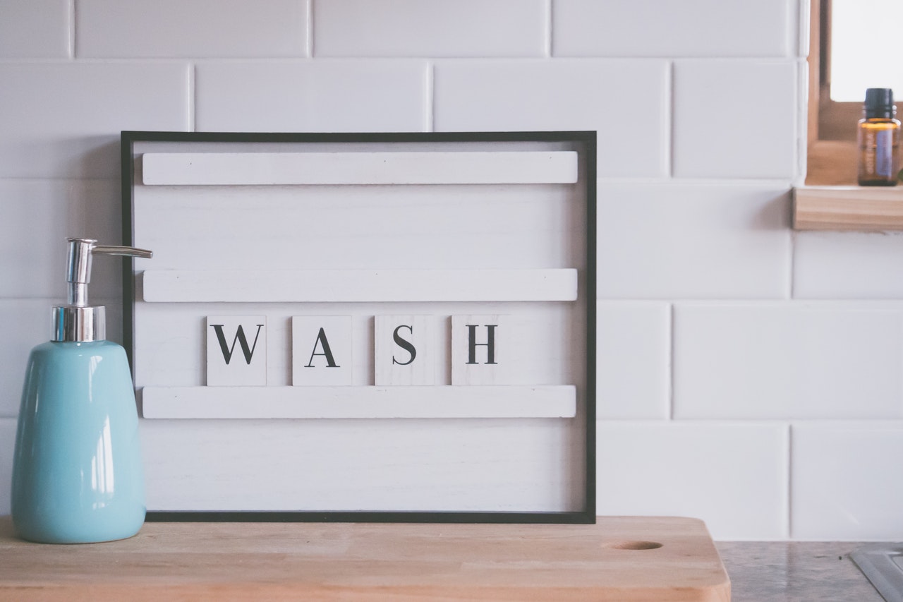 Board with writting saying wash