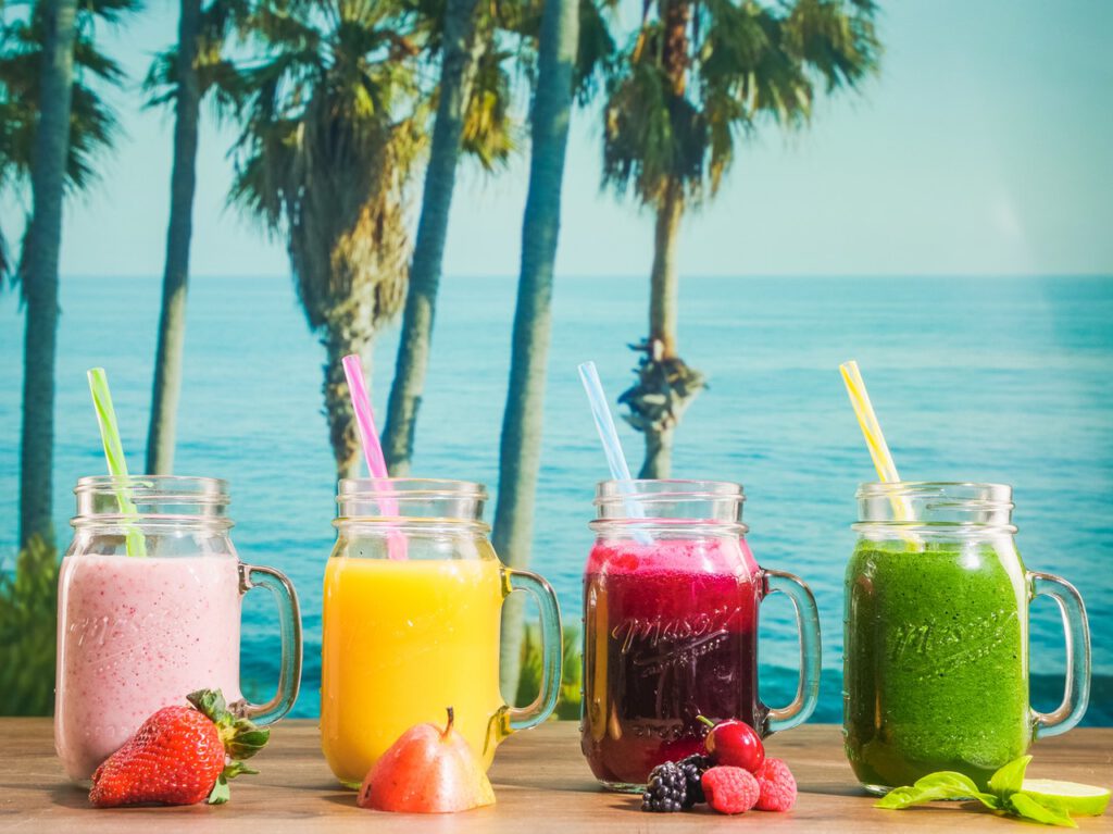 Four colorful protein shakes
