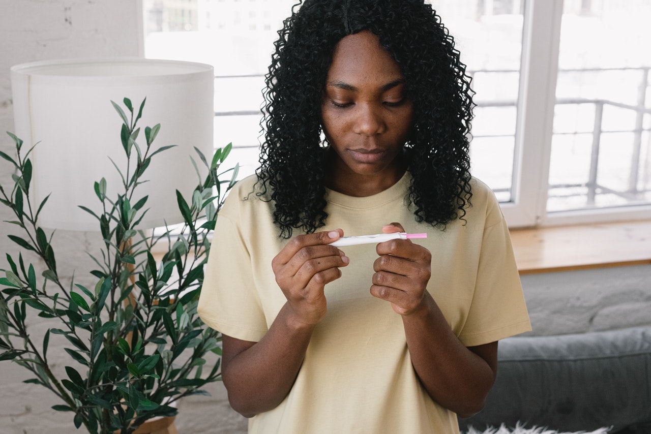 Woman is holding a pragnancy test in her hands